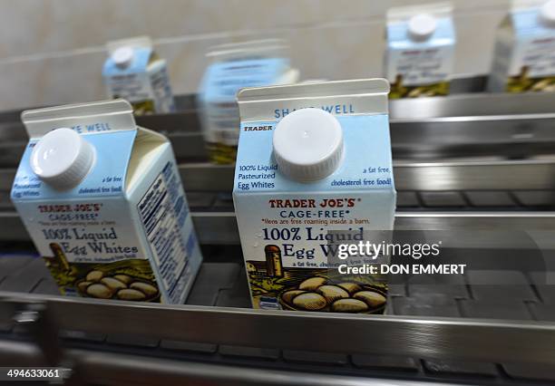 Cartons of liquid egg whites exit a loading machine at the Deb El processing plant on May 29, 2014 in Thompsonville, New York. The plant, about 50...