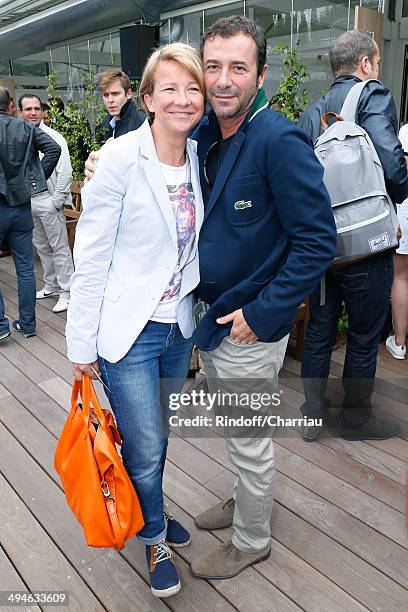 5l6r) Journalist Ariane Massenet and Bernard Montiel attend the Roland Garros French Tennis Open 2014 - Day 6 on May 30, 2014 in Paris, France.