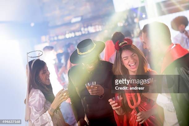 people partying in halloween - party with the devil stock pictures, royalty-free photos & images