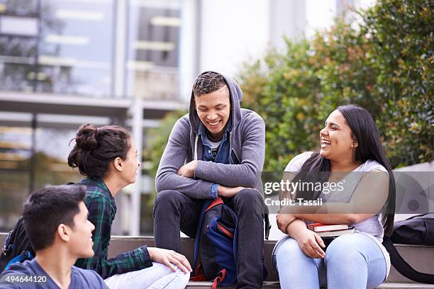 sharing a laugh on campus - varsity stock pictures, royalty-free photos & images