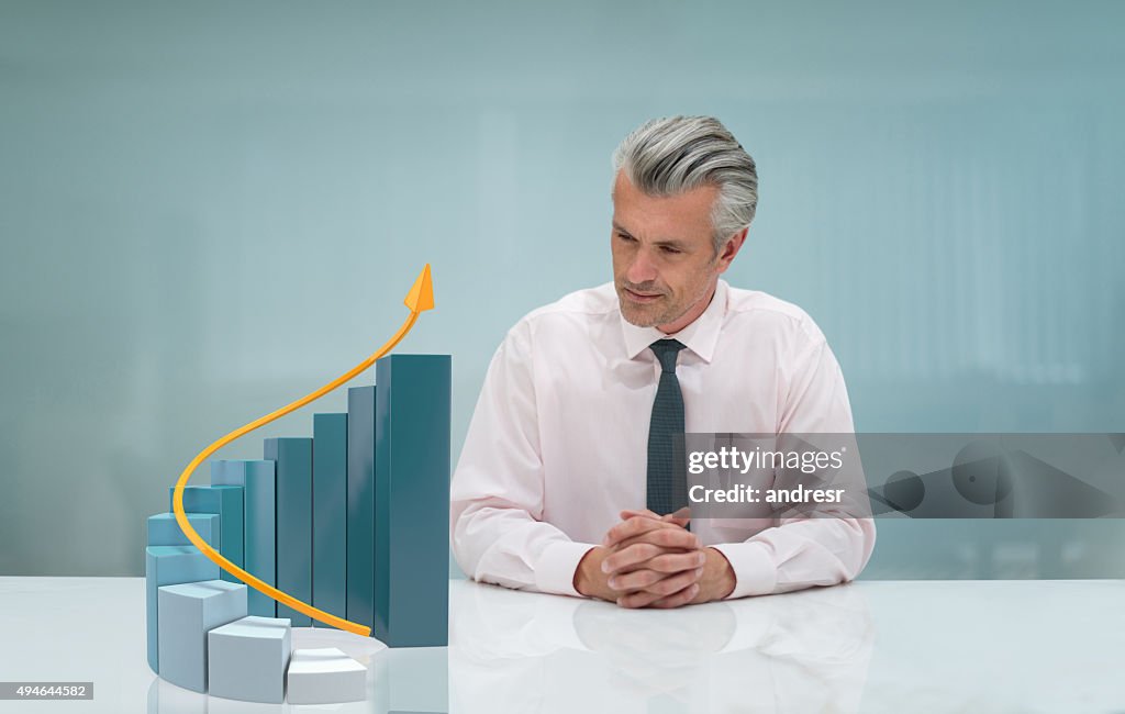 Business man looking at a 3D growth graph