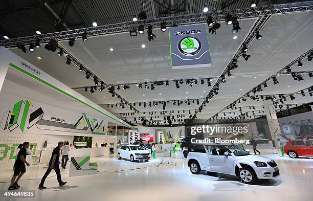 Automobiles stand on display on the Skoda Auto AS stand at the Auto Mobil International automotive trade fair, at Leipziger Messe in Leipzig,...