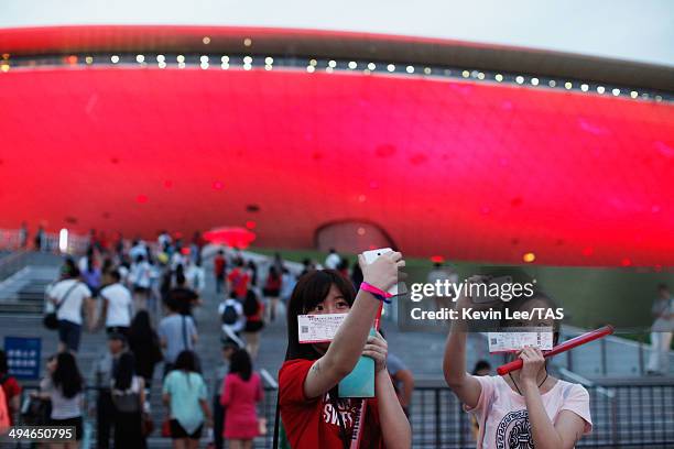 Fans of Taylor Swift do selfie outside Mercedes-Benz Arena on May 30, 2014 in Shanghai, China.