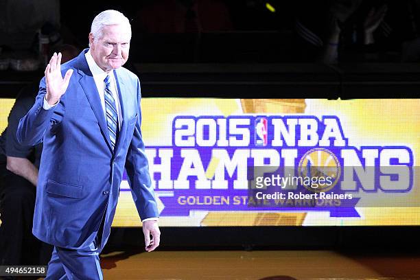 Executive Board Member Jerry West waves to the crowd during the ring ceremony for the 2015 Golden State Warriors championship season prior to the NBA...