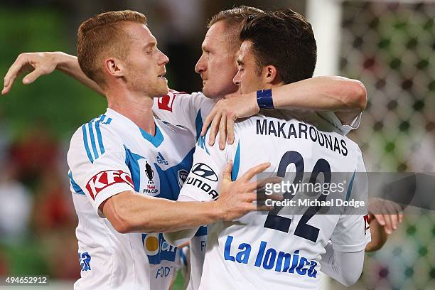 Besart Berisha of the Victory celebrates a penalty goal with Oliver Bozanic and Jesse Makarounas during the FFA Cup Semi Final match between Hume...