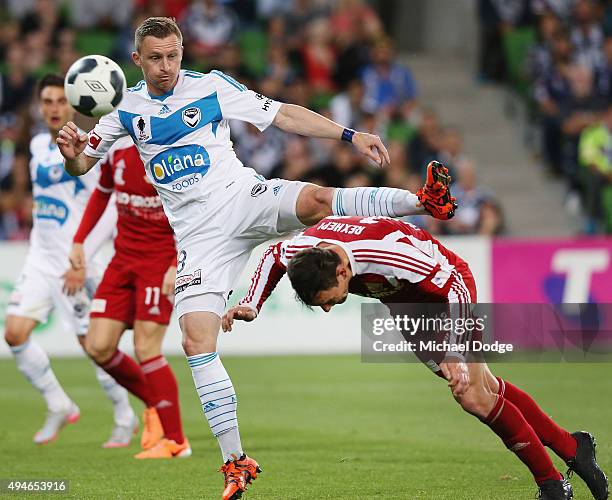 Shane Rexhepi of the City headers the ball away from Besart Berisha of the Victory during the FFA Cup Semi Final match between Hume City and...