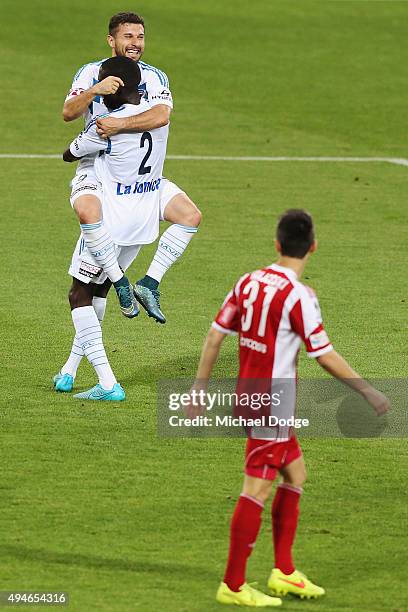 Kosta Barbarouses of the Victory jumps on Jason Geria after he kicked a goal during the FFA Cup Semi Final match between Hume City and Melbourne...