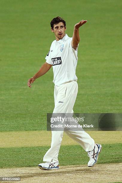 Mitchell Starc of the Blues gestures to the dressing room as he celebrates getting the wicket of Kelvin Smith of the Redbacks during day one of the...