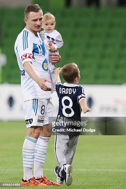 Besart Berisha of the Victory walks off with his kids during the FFA Cup Semi Final match between Hume City and Melbourne Victory at AAMI Park on...