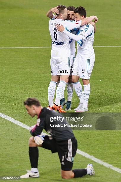 Kosta Barbarouses of the Victory is mobbed by Besart Berisha and Jesse Makarounas after kicking a goal during the FFA Cup Semi Final match between...