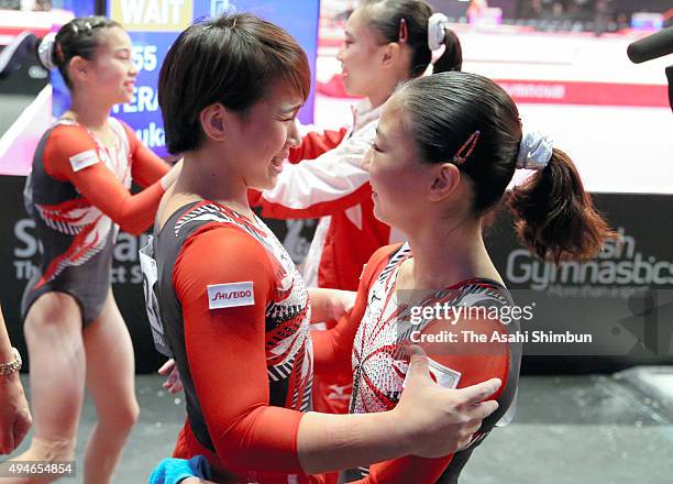 Mai Murakami and Asuka Teramoto of Japan celebrate after the Team competition during day five of World Artistic Gymnastics Championship at The SSE...