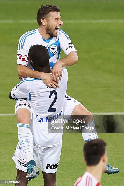 Kosta Barbarouses of the Victory jumps on Jason Geria after he kicked a goal during the FFA Cup Semi Final match between Hume City and Melbourne...