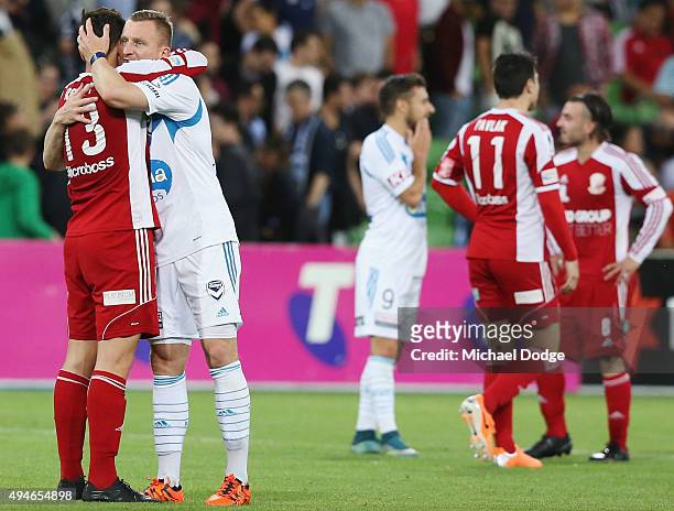Besart Berisha of the Victory and Shane Rexhepi of the City hug after the FFA Cup Semi Final match between Hume City and Melbourne Victory at AAMI...