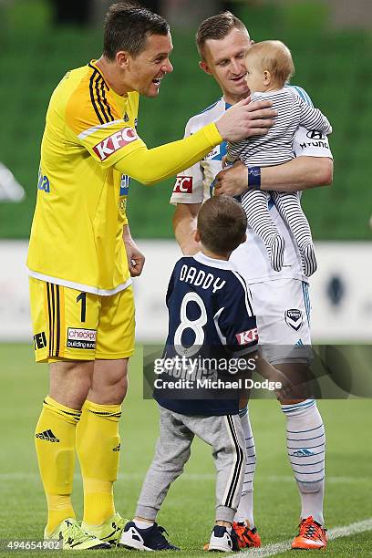 Victory goalkeeper Danny Vukovic celebrates the win with Besart Berisha of the Victory and his kids during the FFA Cup Semi Final match between Hume...