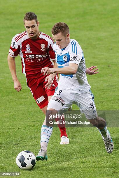 Scott Galloway of the Victory controls the ball in front of Jai Bingham of the City during the FFA Cup Semi Final match between Hume City and...