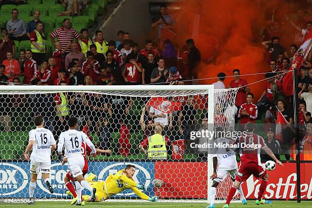 Victory goalkeeper Danny Vukovic saves a goal attempt as a flare goes off during the FFA Cup Semi Final match between Hume City and Melbourne Victory...