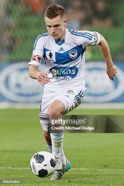 Scott Galloway of the Victory runs with the ball during the FFA Cup Semi Final match between Hume City and Melbourne Victory at AAMI Park on October...