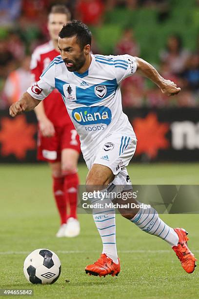 Ben Khalfallah of the Victory runs with the ball during the FFA Cup Semi Final match between Hume City and Melbourne Victory at AAMI Park on October...