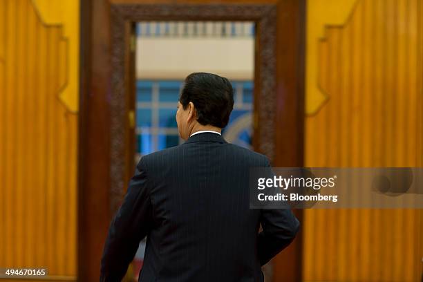 Nguyen Tan Dung, Vietnam's prime minister, leaves the room after an interview in Hanoi, Vietnam, on Friday, May 30, 2014. Vietnam has preparwtlked...