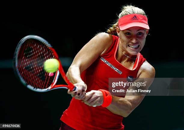 Angelique Kerber of Germany in action against Garbine Muguruza of Spain during the BNP Paribas WTA Finals at Singapore Sports Hub on October 28, 2015...