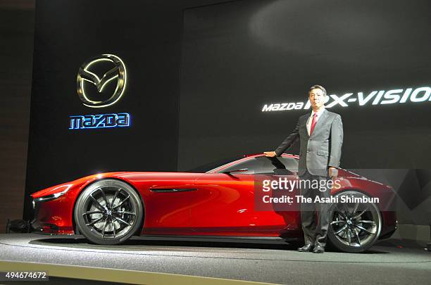 Mazda Motor Co President Masamichi Kogai introduces the RX-Vision during the Tokyo Motor Show at Tokyo Big Sight on October 28, 2015 in Tokyo, Japan....