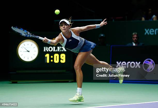 Garbine Muguruza of Spain in action against Angelique Kerber of Germany during the BNP Paribas WTA Finals at Singapore Sports Hub on October 28, 2015...