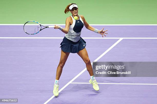 Garbine Muguruza of Spain in action against Angelique Kerber of Germany during the BNP Paribas WTA Finals at Singapore Sports Hub on October 28, 2015...