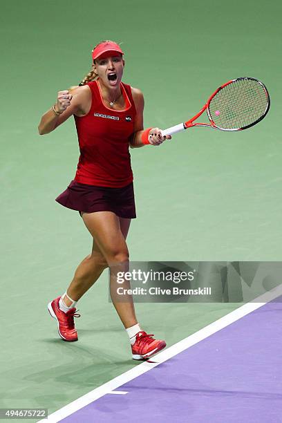 Angelique Kerber of Germany reacts to a point against Garbine Muguruza of Spain during the BNP Paribas WTA Finals at Singapore Sports Hub on October...