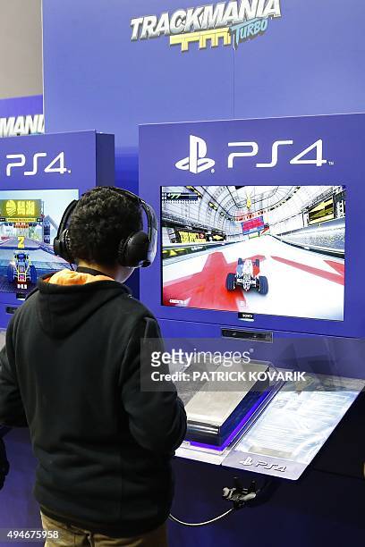 Visitor plays Trackmania, a video game published by Ubisoft, on October 28, 2015 at the Paris Game Week, a trade fair for video games in Paris. Paris...