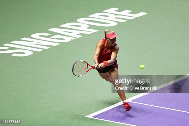 Angelique Kerber of Germany in action against Garbine Muguruza of Spain during the BNP Paribas WTA Finals at Singapore Sports Hub on October 28, 2015...