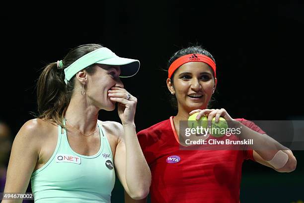 Martina Hingis of Switzerland and Sania Mirza of India in action against Andrea Hlavackova of Czech Republic and Lucie Hradecka of Czech Republic...