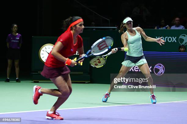 Sania Mirza of India and Martina Hingis of Switzerland in action against Andrea Hlavackova of Czech Republic and Lucie Hradecka of Czech Republic...