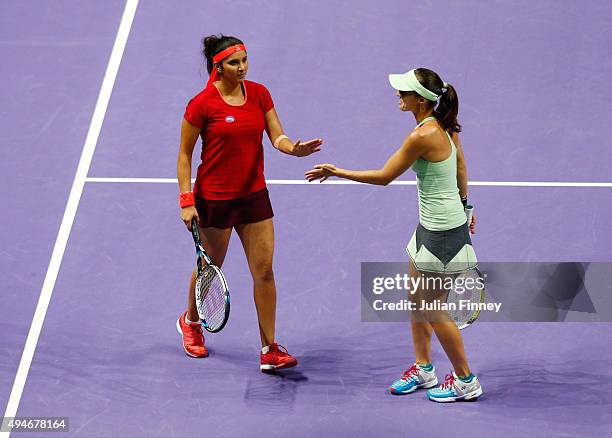 Sania Mirza of India and Martina Hingis of Switzerland in action against Andrea Hlavackova of Czech Republic and Lucie Hradecka of Czech Republic...