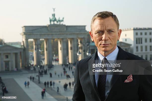 Daniel Craig poses with the Brandenburg Gate behind during a photocall prior the German premiere of the new James Bond movie 'Spectre' at Hotel Adlon...