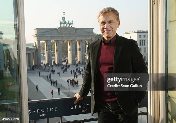 Christoph Waltz stands with the Brandenburg Gate behind during a photocall prior the German premiere of the new James Bond movie 'Spectre' at Hotel...