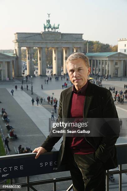 Christoph Waltz stands with the Brandenburg Gate behind during a photocall prior the German premiere of the new James Bond movie 'Spectre' at Hotel...