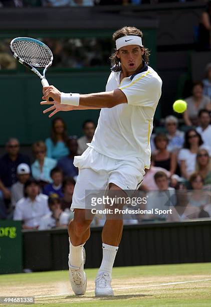 Feliciano Lopez of Spain in action against Lleyton Hewitt of Australia in the Gentlemen?s Singles during the ninth day of the Wimbledon Lawn Tennis...