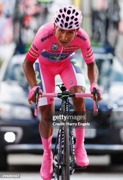 Wearer of the Maglia Rosa leader's jersey Nairo Quintana of Colombia and team Movistar sprints for the finish line during the nineteenth stage of the...