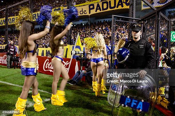 Boca Juniors soccer team cheerleaders are seen as they leave after performing during the match between Boca Junior and Godoy Cruz at La Bombonera...