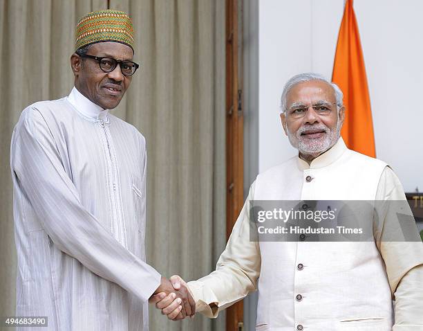 President of Nigeria Muhammadu Buhari meets with Prime Minister Narendra Modi before a bilateral meeting for the 3rd India-Africa Forum Summit at...