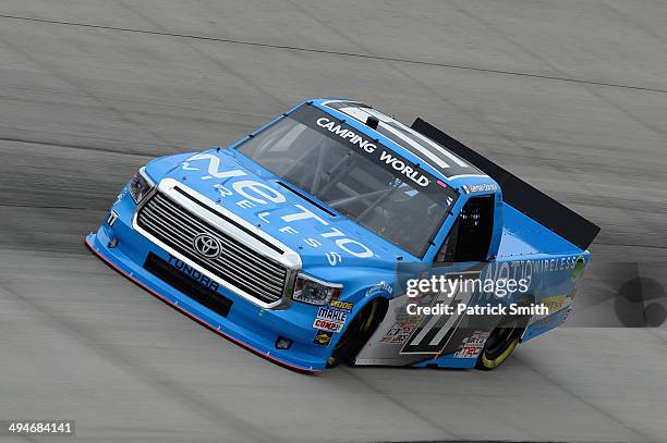 German Quiroga, driver of the NET10 Wireless Toyota, practices for the NASCAR Camping World Truck Series Lucas Oil 200 at Dover International...