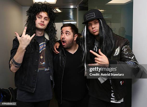 Michael Clifford, SiriusXM Hits 1 host Mikey Piff and Ashton Irwin of 5 Seconds of Summer dress up in halloween costumes at the SiriusXM Studios on...