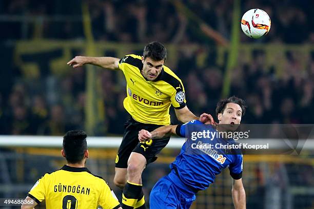 Sokratis of Dortmund and Srdjan Lakic of Paderborn go up for a header during the DFB Cup match between Borussia Dortmund and SC Paderborn at Signal...