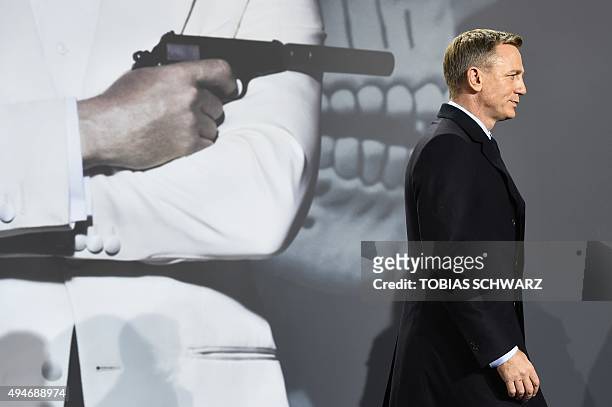 British actor Daniel Craig poses for photographers at a photocall for the new James Bond film 'Spectre' on October 28, 2015 in Berlin. AFP PHOTO /...