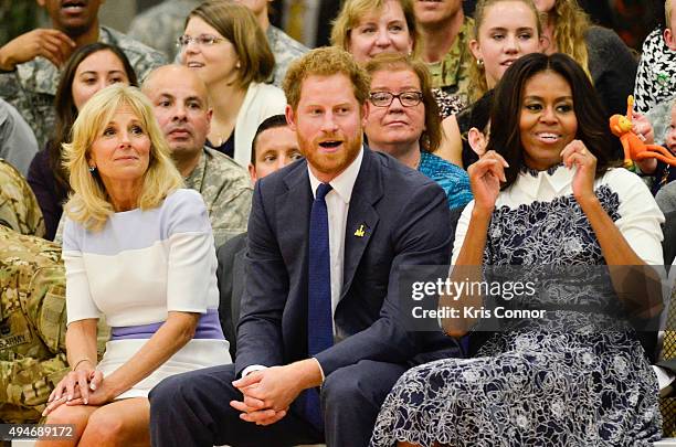 Doctor Jill Biden, Prince Harry and First Lady Michelle Obama watch during the Joining Forces Invictus Games 2016 Event at the Wells Fields House on...
