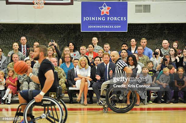 Doctor Jill Biden, Prince Harry and First Lady Michelle Obama watch during the Joining Forces Invictus Games 2016 Event at the Wells Fields House on...