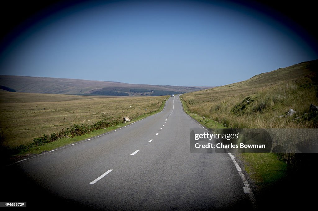 An empty road snakes through the Brecon Beacons