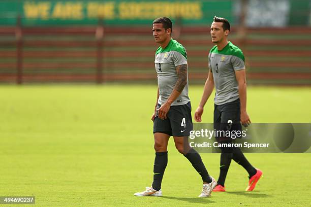 Tim Cahill of the Socceroos and Jason Davidson of the Socceroos walk during an Australian Socceroos training session at Arena Unimed Sicoob on May...