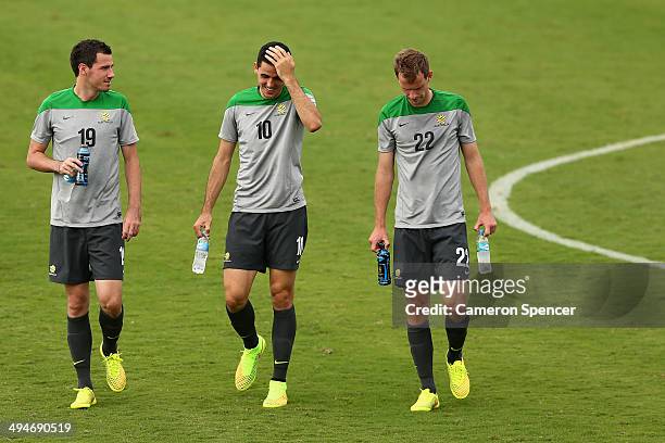Ryan McGowan, Tom Rogic and Alex Wilkinson of the Socceroos walk accross the pitch during an Australian Socceroos training session at Arena Unimed...
