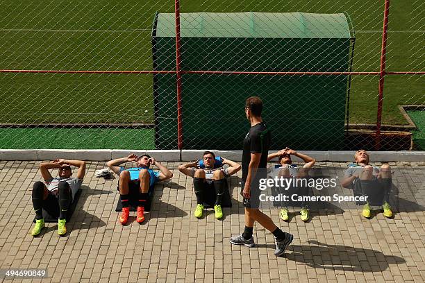 Socceroo players stretch during an Australian Socceroos training session at Arena Unimed Sicoob on May 30, 2014 in Vitoria, Brazil.